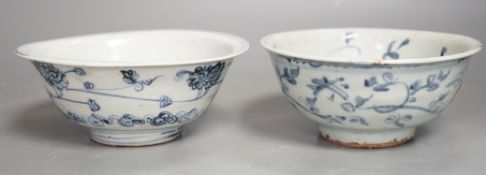 Two Chinese late Ming blue and white bowls, 16th/17th century, painted with flowers and foliage,