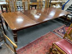 A Victorian mahogany extending dining table, 320cms extended, three spare leaves, depth 130cms,