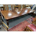 A Victorian mahogany extending dining table, 320cms extended, three spare leaves, depth 130cms,