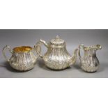 A Victorian engraved silver three piece tea set, of pear shape, by John Samuel Hunt (Hunt &