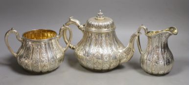 A Victorian engraved silver three piece tea set, of pear shape, by John Samuel Hunt (Hunt &