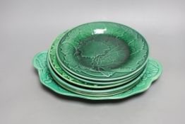 A collection of 19th century greenware leaf plates and a dish