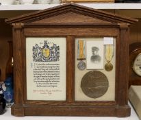 An oak framed and glazed WWI presentation group to Rifleman William Mervyn Polleck Trower, including