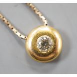 A modern 9ct gold and solitaire diamond set pendant necklace, pendant 9mm, chain, 39cm, gross weight