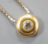 A modern 9ct gold and solitaire diamond set pendant necklace, pendant 9mm, chain, 39cm, gross weight