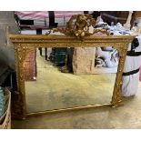A Victorian giltwood and composition overmantle mirror with cherub pediment width height