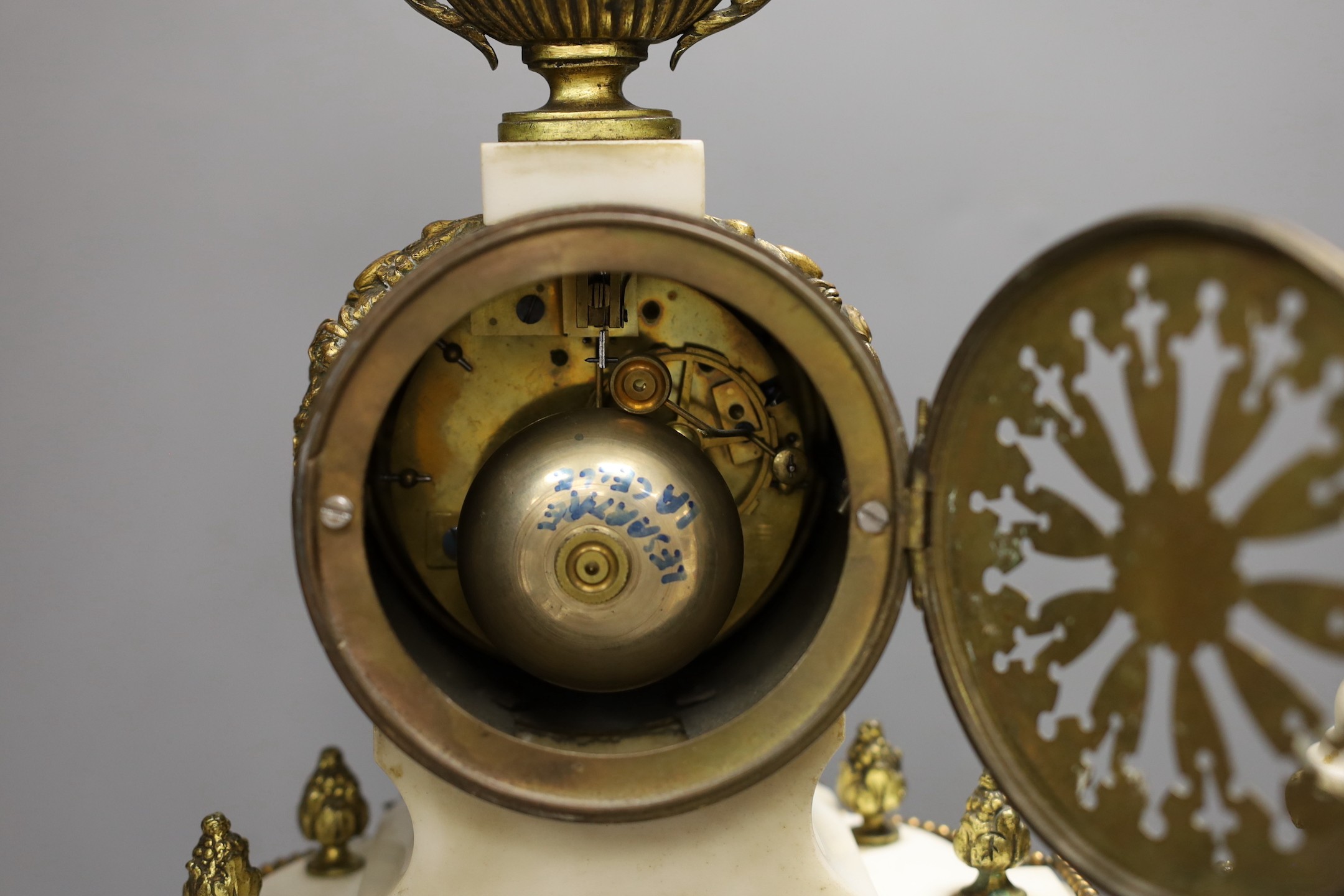 A Louis XVI style white marble and ormolu clock garniture, clock 47cms high - Image 3 of 4