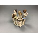 A Meissen group of four putti musicians, late 19th century, 11cm high, losses