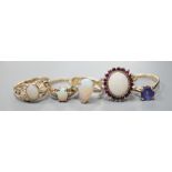 Five assorted modern 9ct gold and gem set dress rings, including white opal and garnet oval cluster,