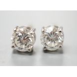 A pair of 18ct gold and solitaire diamond set ear studs, stone diameter approx. 4.8mm, gross