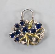 A yellow and white metal, sapphire and diamond cluster set oval pendant, 20mm, gross weight 3.8
