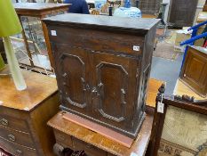 An 18th century panelled oak wall cupboard, width 69cm, depth 27cm, height 77cm