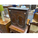 An 18th century panelled oak wall cupboard, width 69cm, depth 27cm, height 77cm