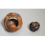 A Japanese mask nut carving wood carving, Meiji period and a netsuke of frogs, marks to bases,