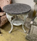 A Victorian cast iron circular garden table with weathered stone top, diameter 61cm, height 72cm