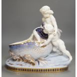 A Copeland porcelain putti seated on a shell centrepiece, modelled O. Hale, c.1877, 35cms high