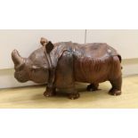 A carved wooden model of a rhinoceros, approximately 60cms long Ivory submission reference: