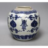 An 18th century Chinese blue and white jar, painted with ‘shou’, flowers and tendrils, 22cm high