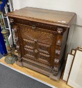 A late 19th century Flemish carved oak side cabinet, width 89cm, depth 50cm, height 104cm