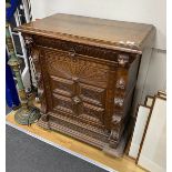 A late 19th century Flemish carved oak side cabinet, width 89cm, depth 50cm, height 104cm