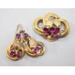 A Victorian yellow metal, oval and round cut garnet set demi parure, comprising a scroll work brooch