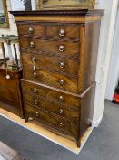 A George III mahogany chest on chest with dentil cornice, two short and six graduated long draws
