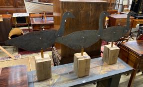 A set of three primitive style copper wildfowlers silhouette decoy models of geese with