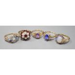 Five assorted modern 9ct gold and gem set dress rings, including, white opal cluster, garnet and