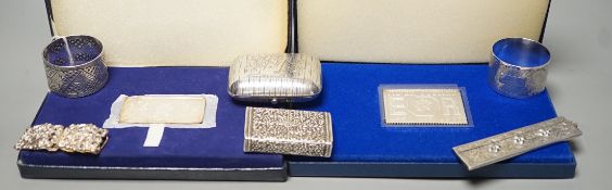 Small silver items including two napkin rings, a modern cased commemorative plaque and replica