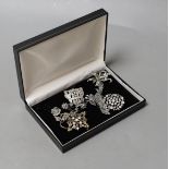 Seven assorted marcasite or paste brooches.