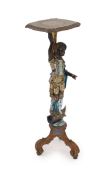 A 19th century Venetian carved wood and polychrome gondolier blackamoor table, the stem carved as