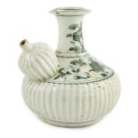 A Chinese late Ming blue and white fluted kendi, Zhangzhou kilns, the neck and shoulder painted with