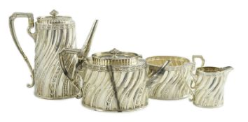 A late Victorian silver four tea and coffee service, by Walter & John Barnard, of oval form with