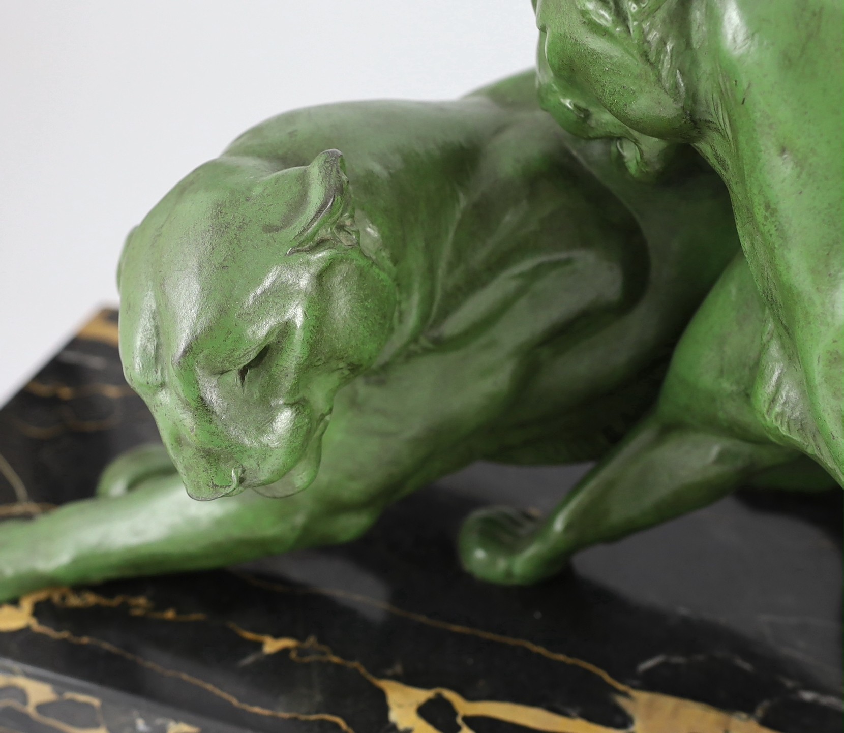 Plagner. An Art Deco patinated spelter group of two panthers, standing upon a veined marble base - Image 2 of 4