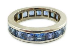 A platinum? and square cut sapphire set full eternity ring, size O, gross weight 7.7 grams.***
