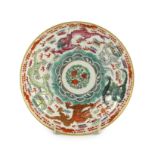 A Chinese famille rose fencai ‘dragon’ saucer dish, Jiaqing four character seal mark, 19th