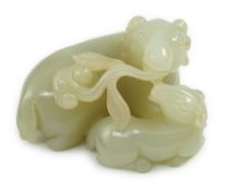 A Chinese pale celadon jade ram group, carved in high relief and openwork with a ram and young