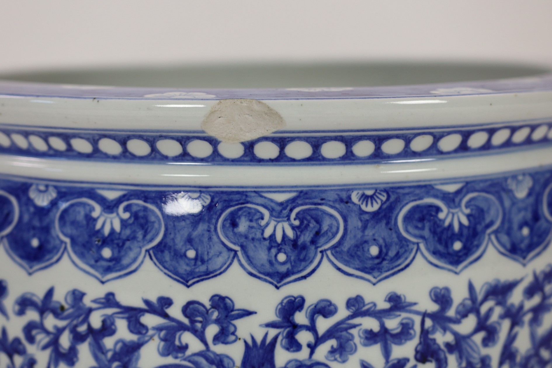 A Chinese blue and white ‘fish’ bowl, 20th century, painted with lotus flowers, scrolling tendrils - Image 5 of 5