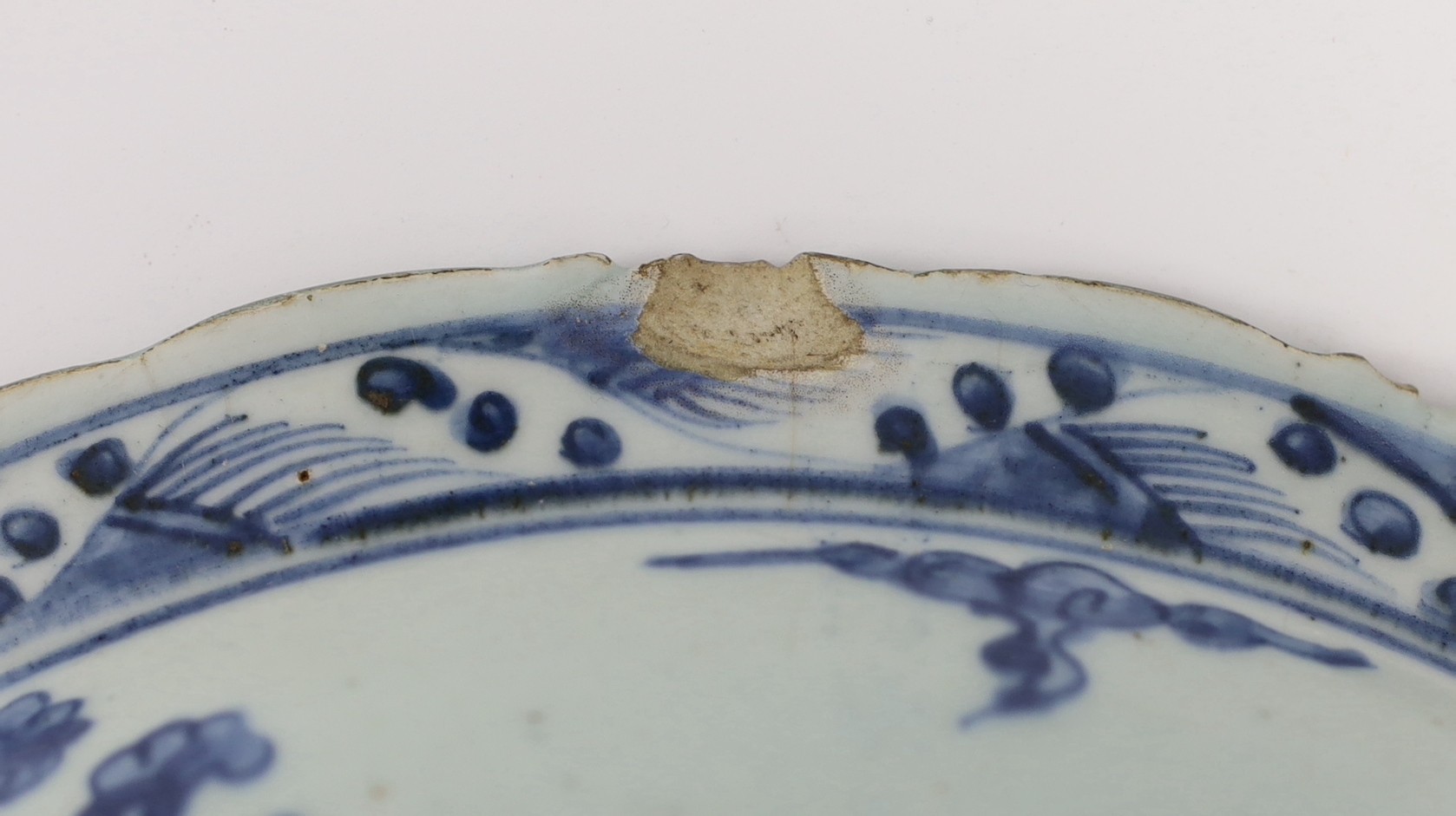A Chinese Ming blue and white ‘lion’ dish, four character Ming mark, painted with four lions amid - Image 4 of 4
