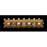 An early 20th century gold three stone diamond and four stone split pearl set bar brooch, with
