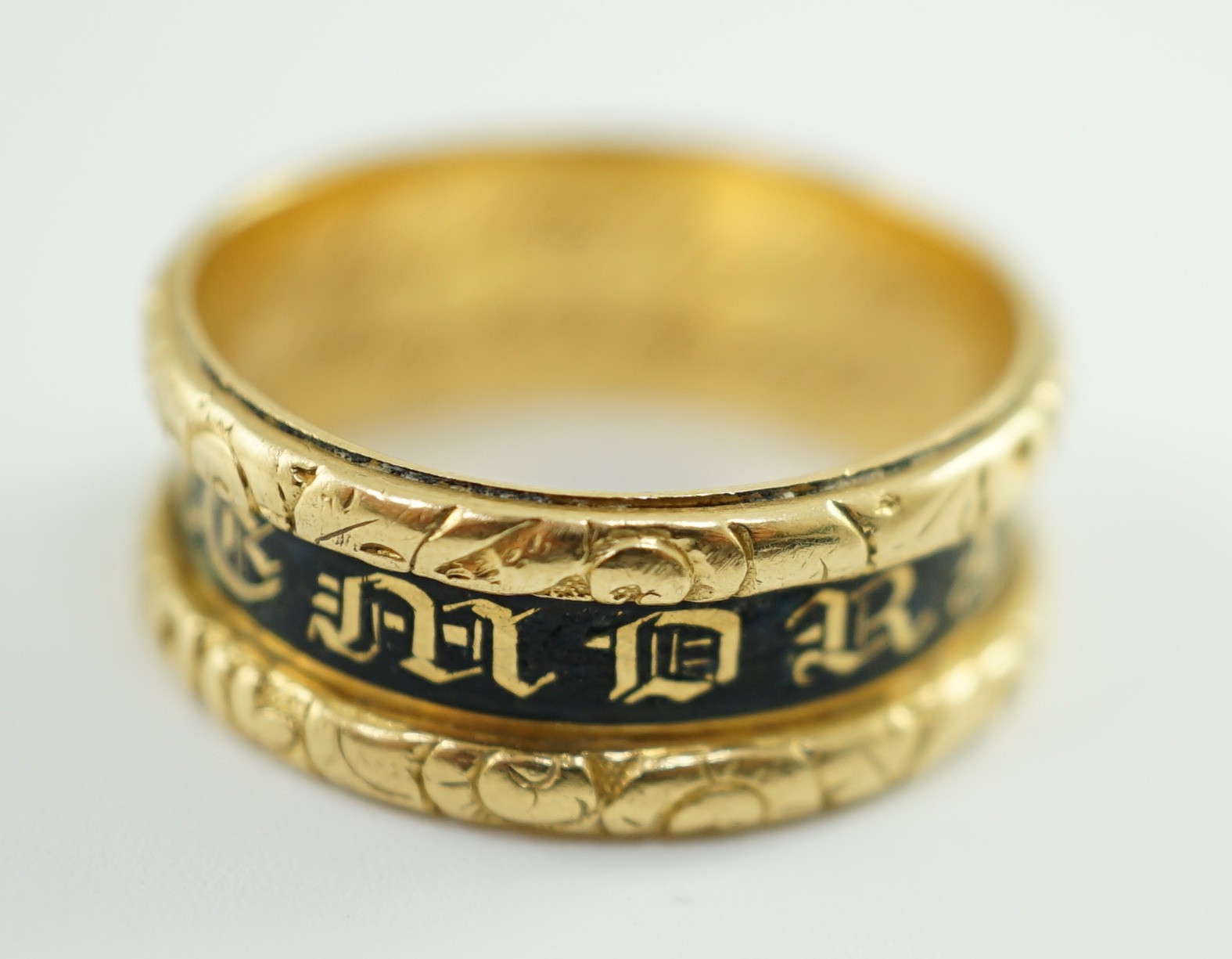 A George IV 18ct gold and black enamel 'In Memory Of' mourning band, with carved scroll border, - Image 3 of 9