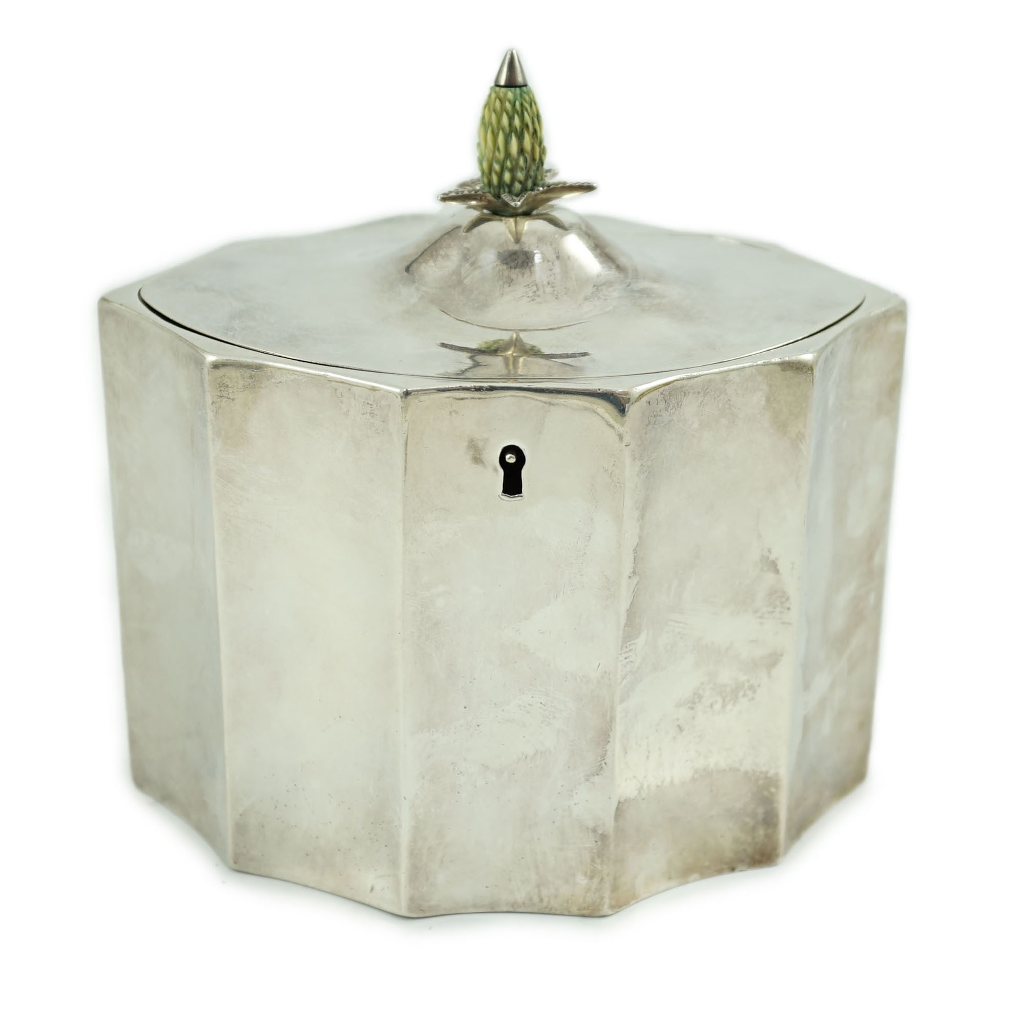 A George III oval tea caddy, by Henry Chawner, of bats wing oval shape, with carved stained ivory