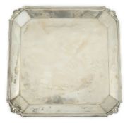 A George V square silver salver, by Atkin Brothers, with reeded border and canted corners with shell