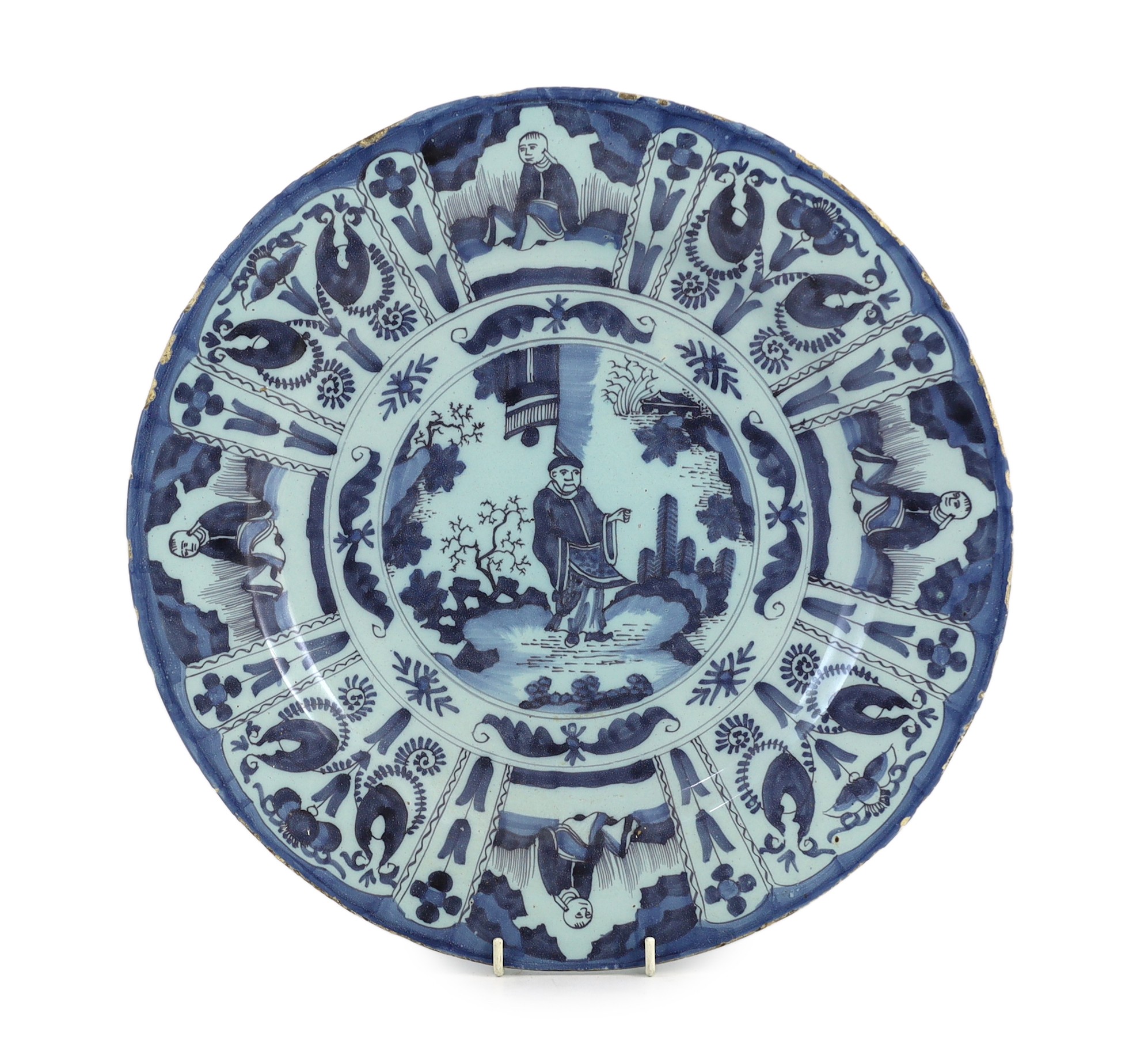 A Delft blue and white Kraak style dish, late 17th century, the centre painted with a Chinese figure