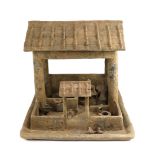 A large Chinese grey pottery model of a farmstead, Han dynasty (200BCE - 220CE), the open roofed