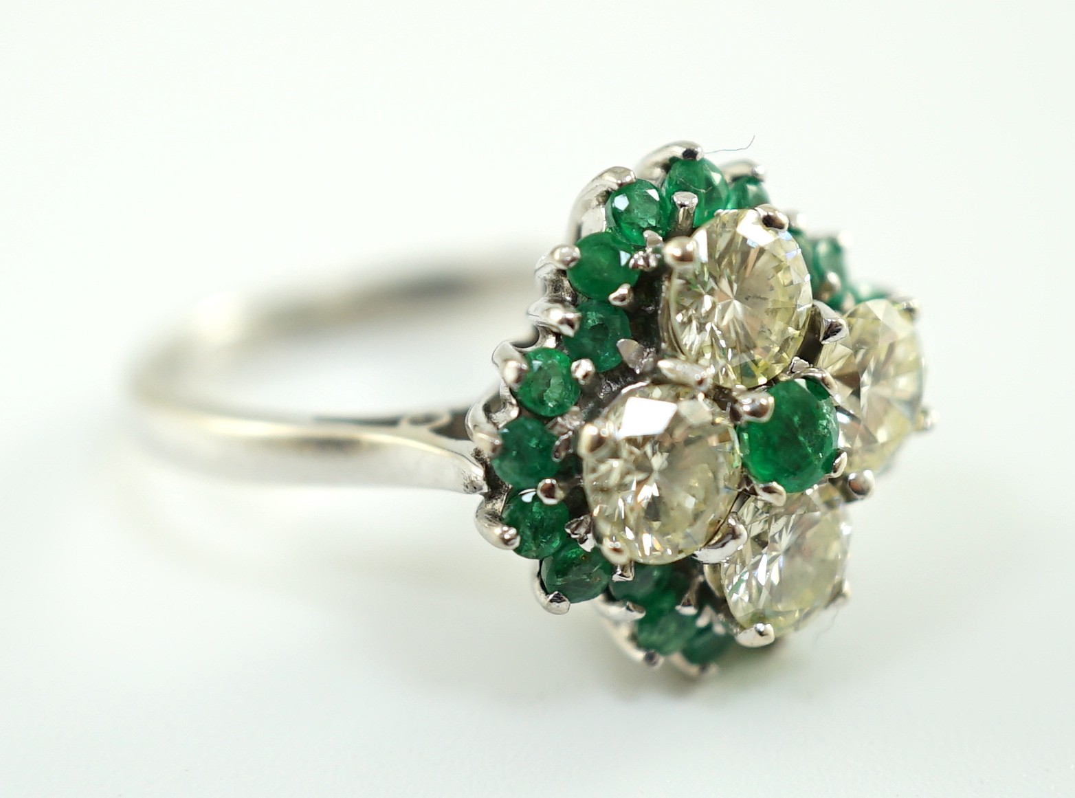 An 18ct white gold, emerald and diamond cluster set dress ring, the four diamonds with a total - Image 4 of 4
