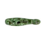 A Chinese bright spinach green jade ‘dragon’ belt hook, 18th/19th century, carved in high relief and