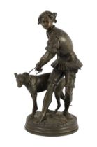 Adrien Etienne Gaudez (French, 1845-1902). A bronze group of a huntsman and hound, signed in the