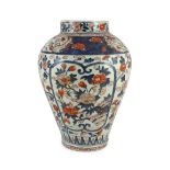 A large Japanese Arita ovoid vase, 18th century, painted in Imari palette with peonies,