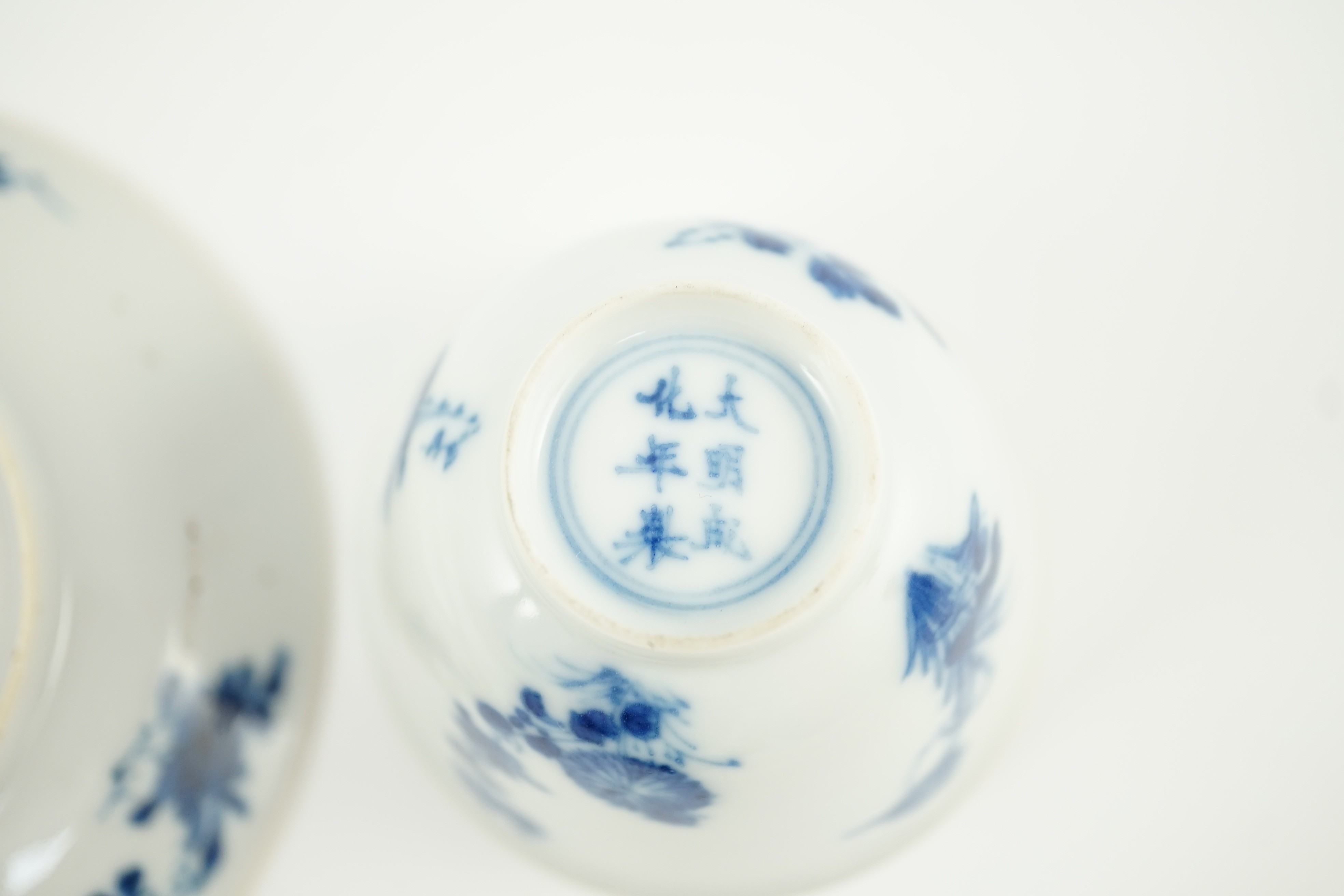 A Chinese blue and white tea bowl and saucer, Chenghua mark but Kangxi period, each painted with - Image 3 of 4